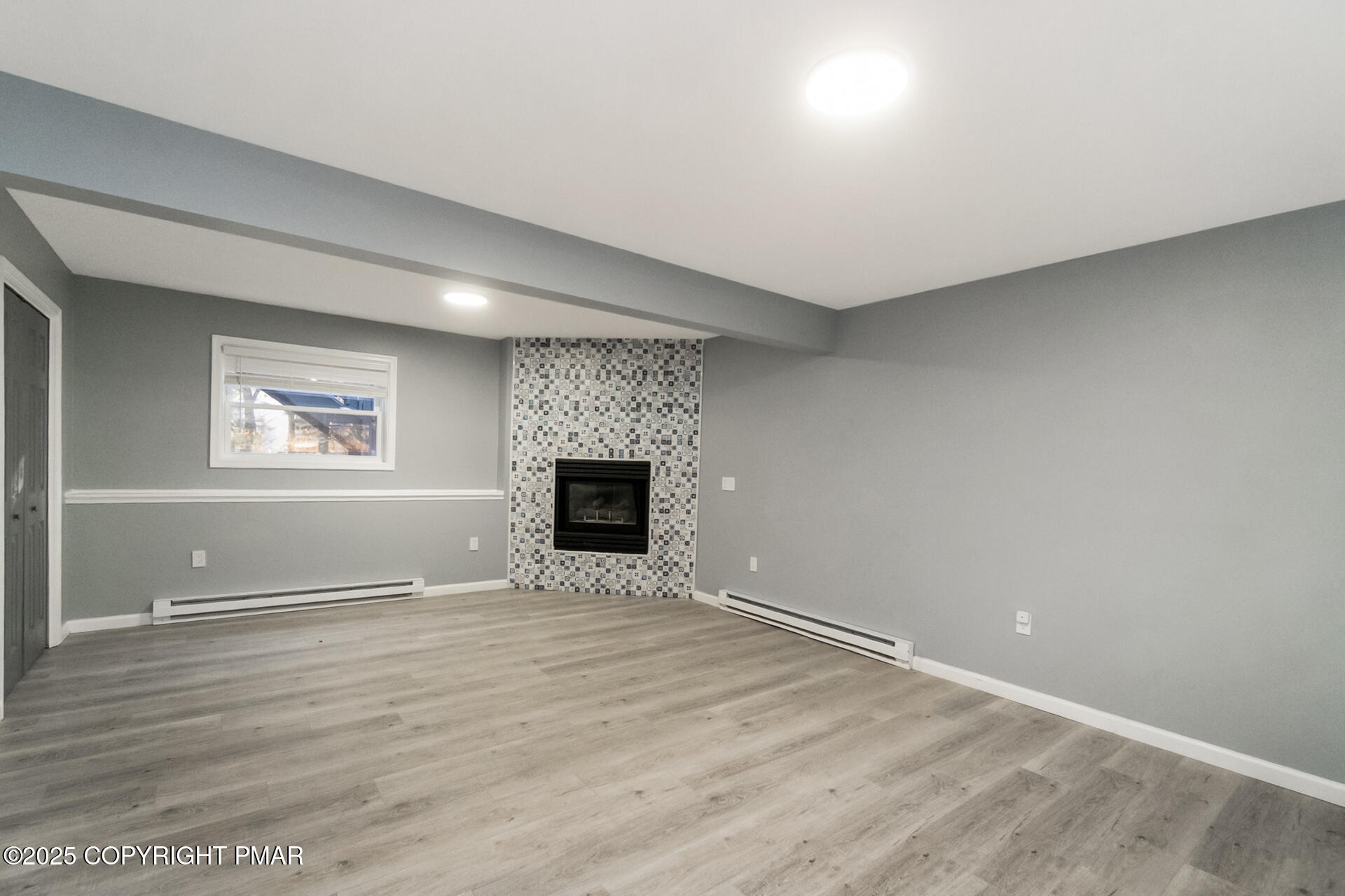 411 Alter Avenue Pocono Summit, PA 18346 - Photo 21 of 29 a view of empty room with wooden floor and fan
