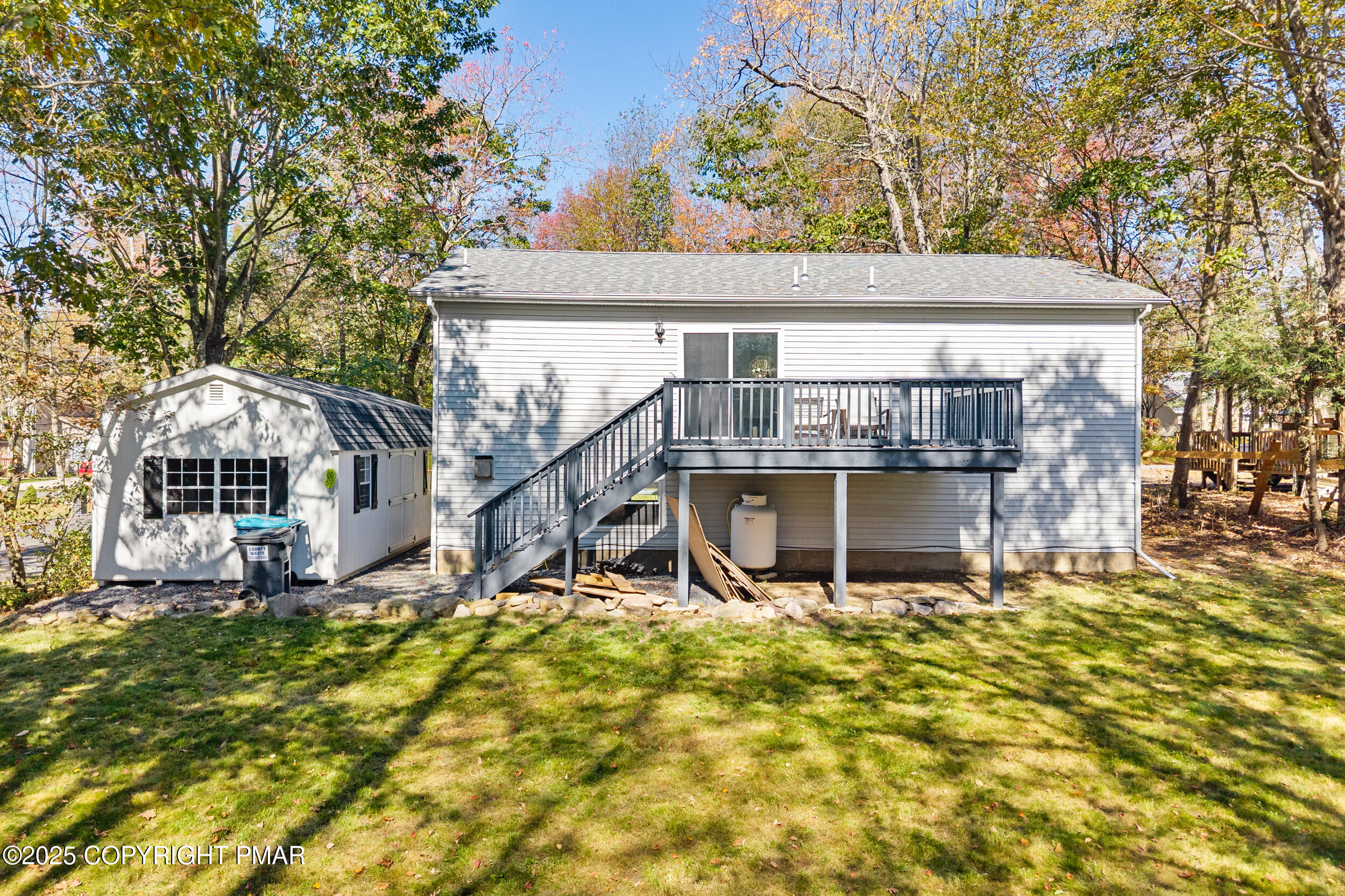 411 Alter Avenue Pocono Summit, PA 18346 - Photo 24 of 29 front view of a house with a yard