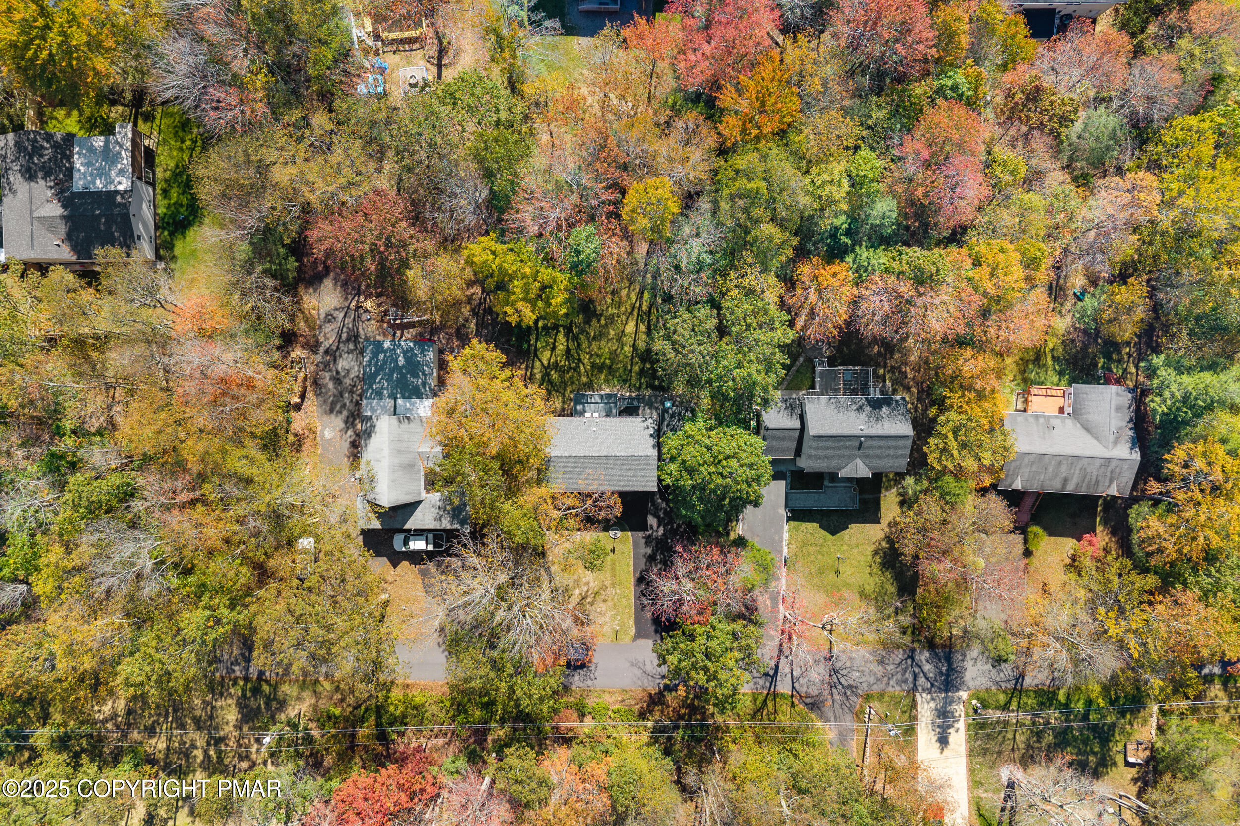 411 Alter Avenue Pocono Summit, PA 18346 - Photo 27 of 29 an aerial view of residential house with parking