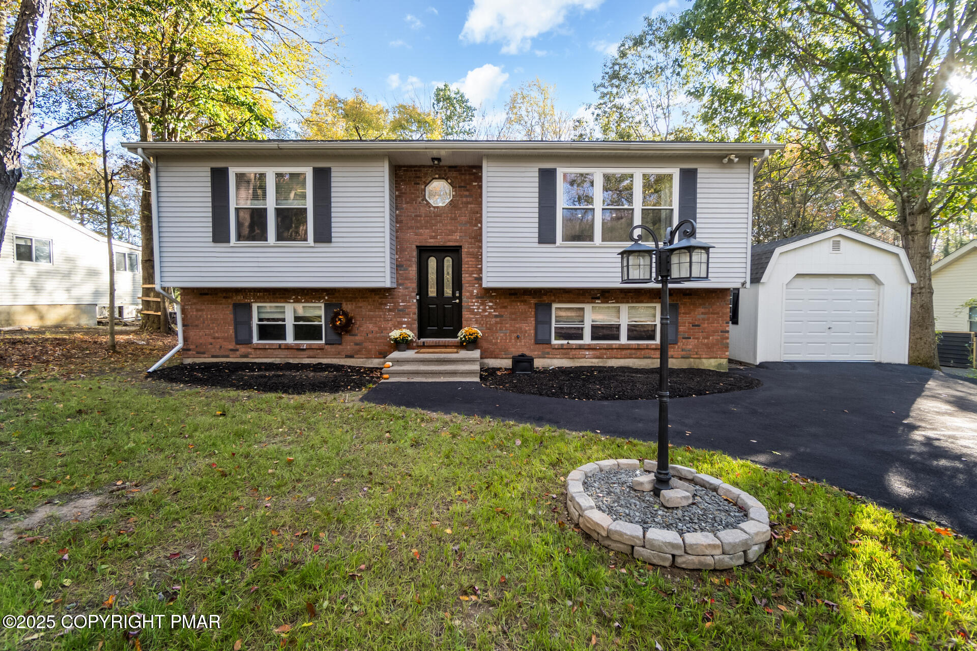 411 Alter Avenue Pocono Summit, PA 18346 - Photo 6 of 29 a front view of a house with a yard
