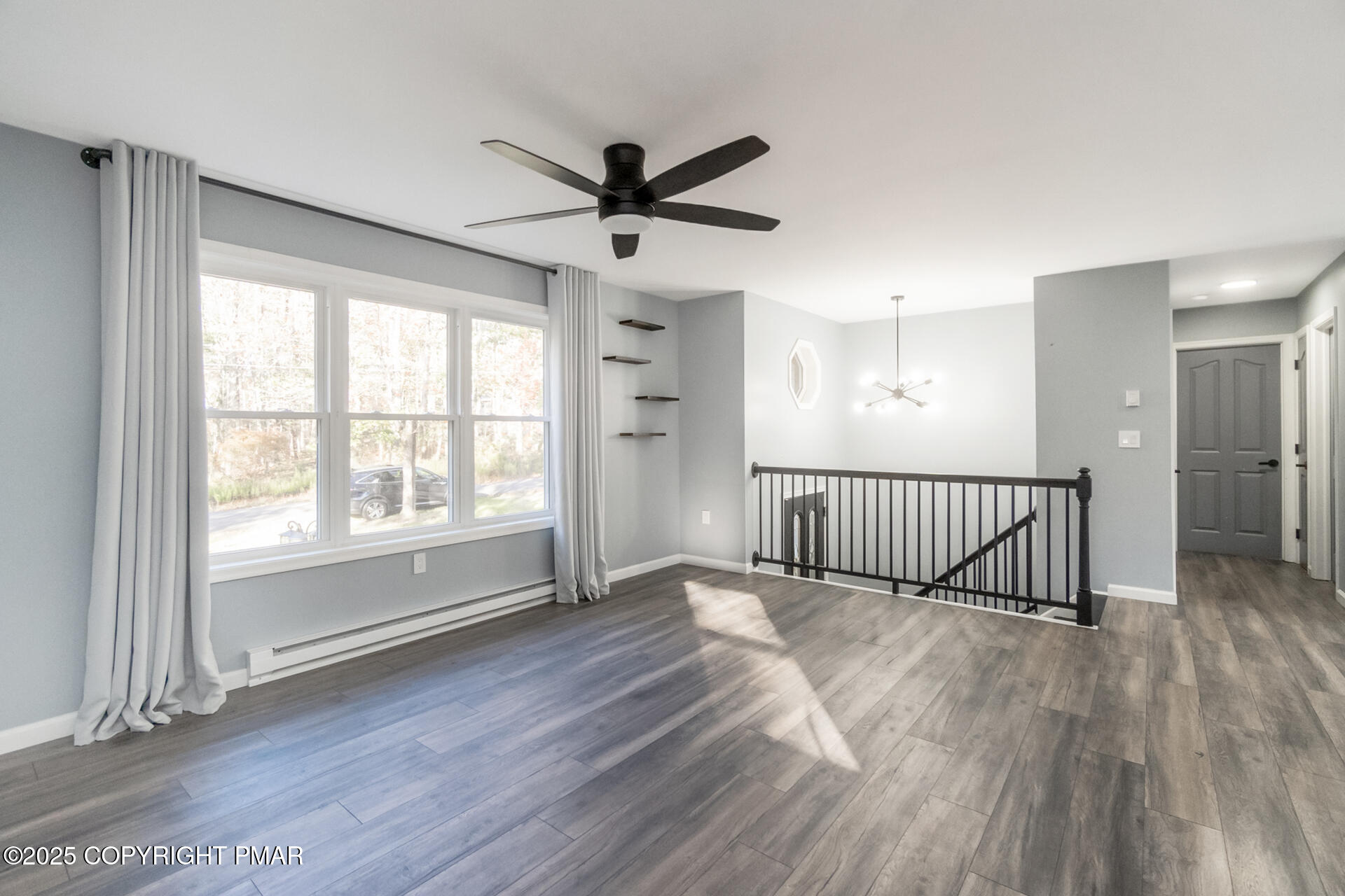 411 Alter Avenue Pocono Summit, PA 18346 - Photo 8 of 29 a view of a livingroom with a ceiling fan and window