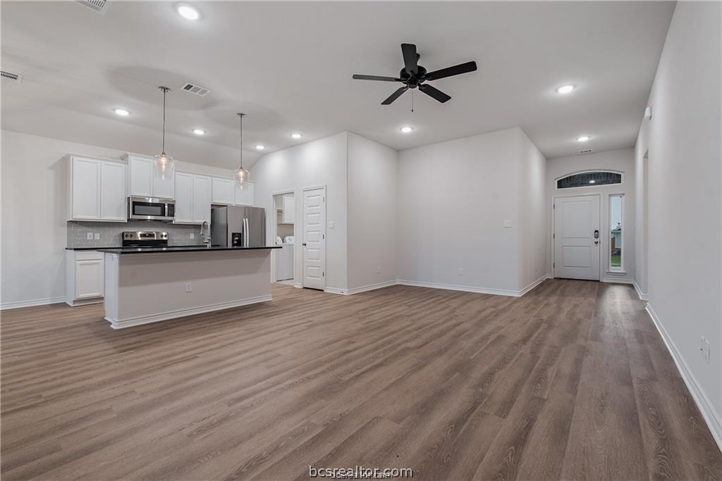 3161 Tarleton Court Bryan, TX 77808 - Photo 6 of 23 a view of a kitchen with a sink and stainless steel appliances