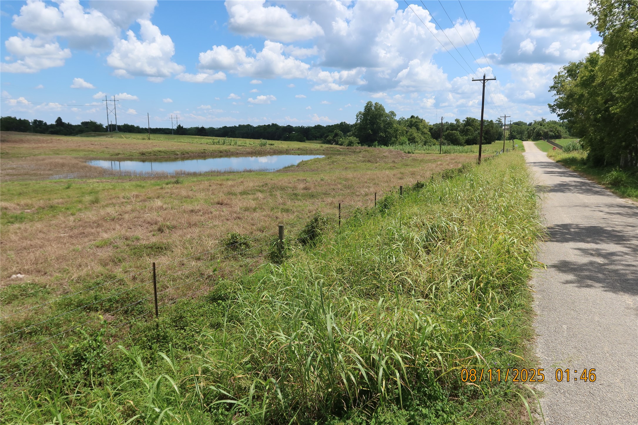 0 Sempronius Road Chappell Hill, TX 77426 - Photo 4 of 25 a view of a lake with houses in the back