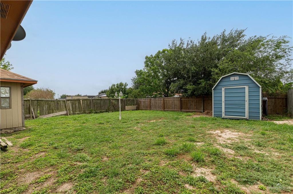 6402 South Mars Lane Pharr, TX 78577 - Photo 14 of 17 a view of a backyard with a garden