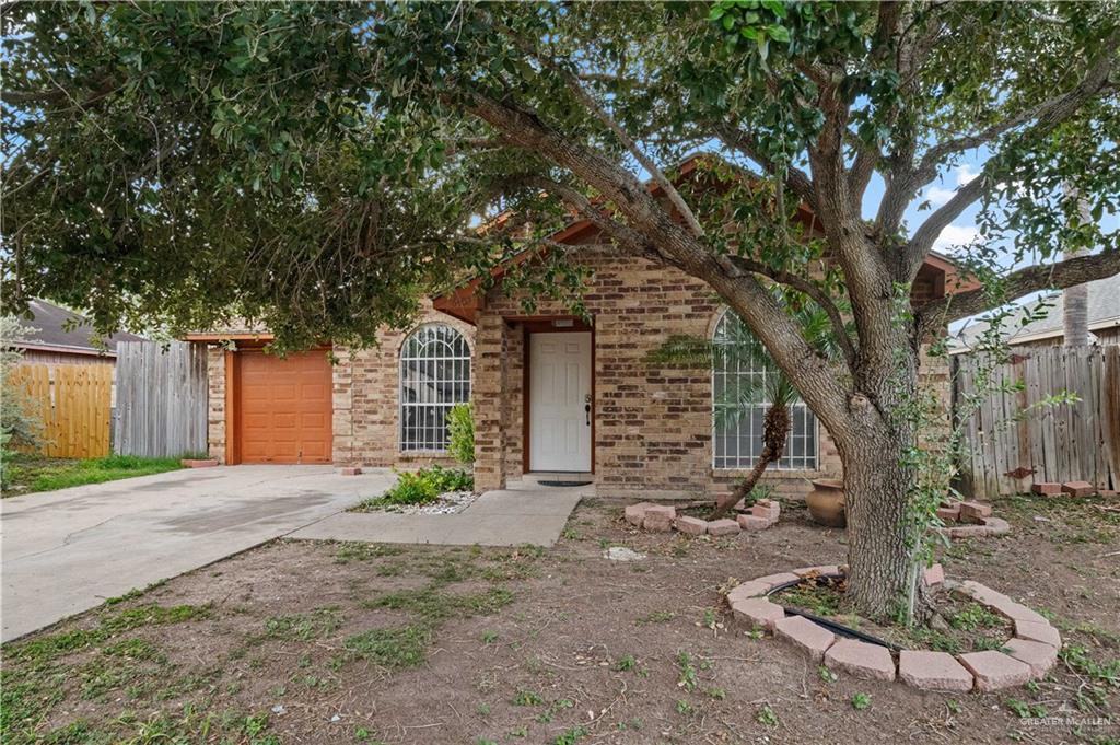 6402 South Mars Lane Pharr, TX 78577 - Photo 17 of 17 a view of a house with large trees and a tree