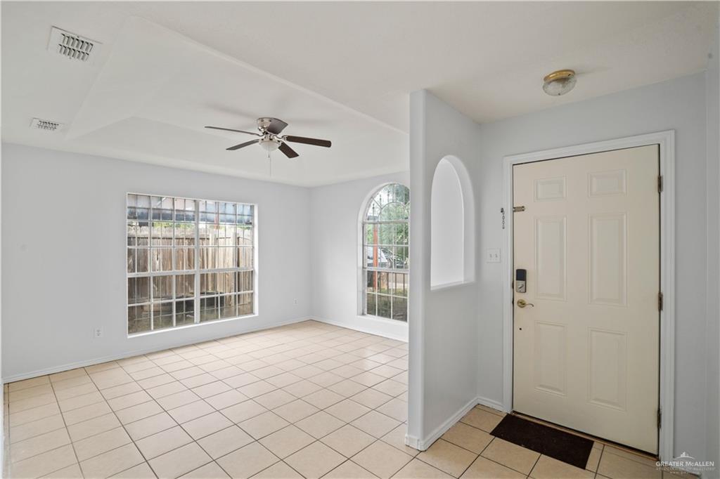 6402 South Mars Lane Pharr, TX 78577 - Photo 3 of 17 a view of an empty room with glass door