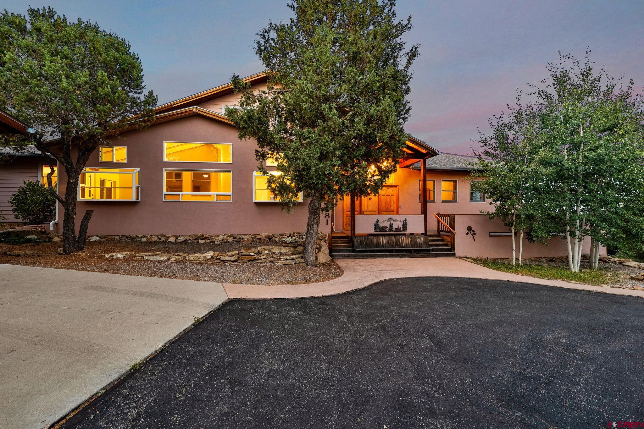 481 Far View Road Durango, CO 81303 - Photo 6 of 45 a view of a house with a yard and garage