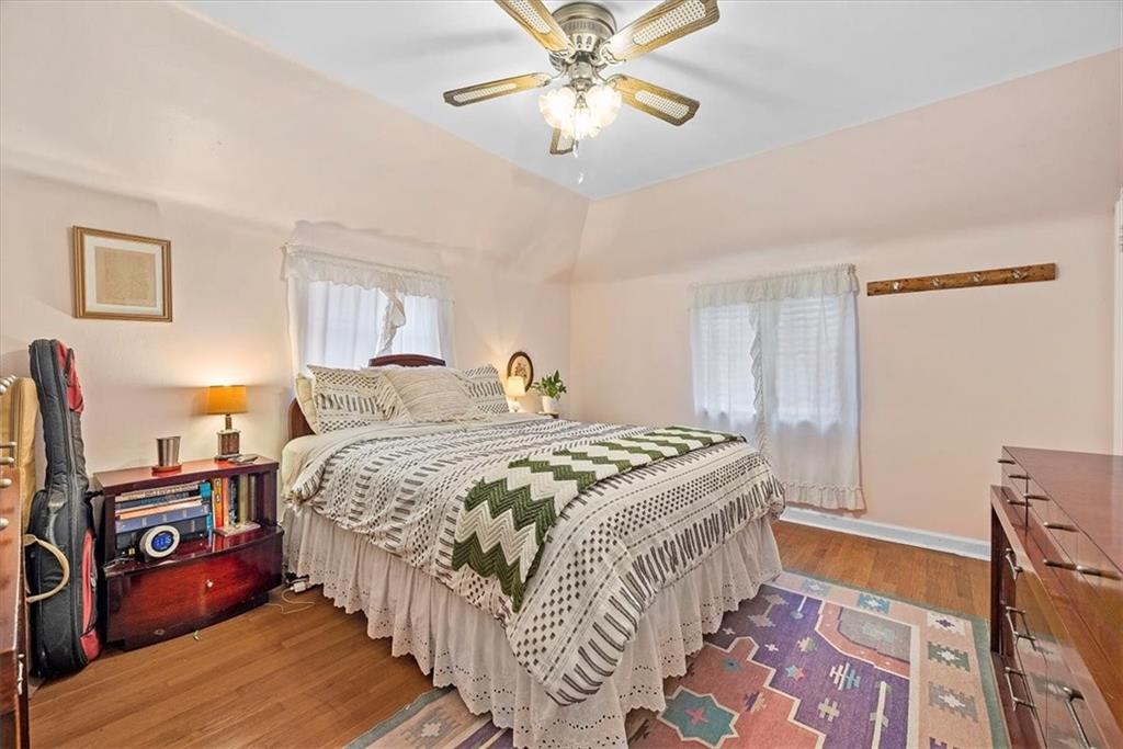 2026 Brookfield Road Pittsburgh, PA 15243 - Photo 16 of 25 a bedroom with a bed and a chandelier