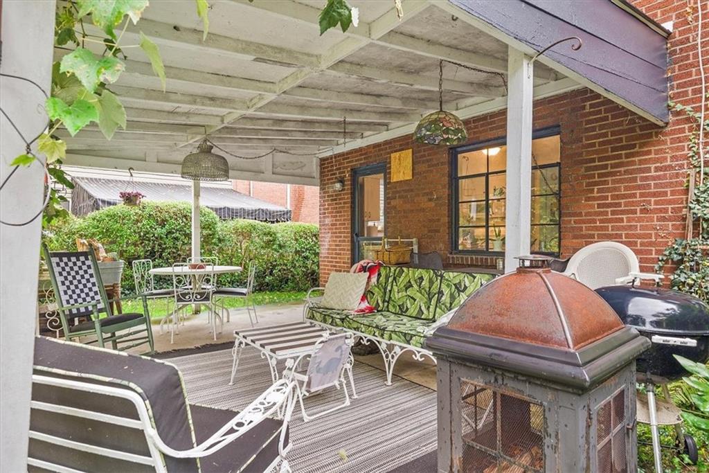 2026 Brookfield Road Pittsburgh, PA 15243 - Photo 20 of 25 a patio table and chairs with potted plants
