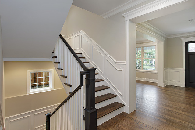 503 Willow Road Winnetka, IL 60093 - Photo 13 of 15 a view of staircase with wooden floor and white walls