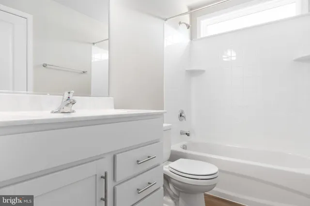 a bathroom with a sink a toilet and a bathtub