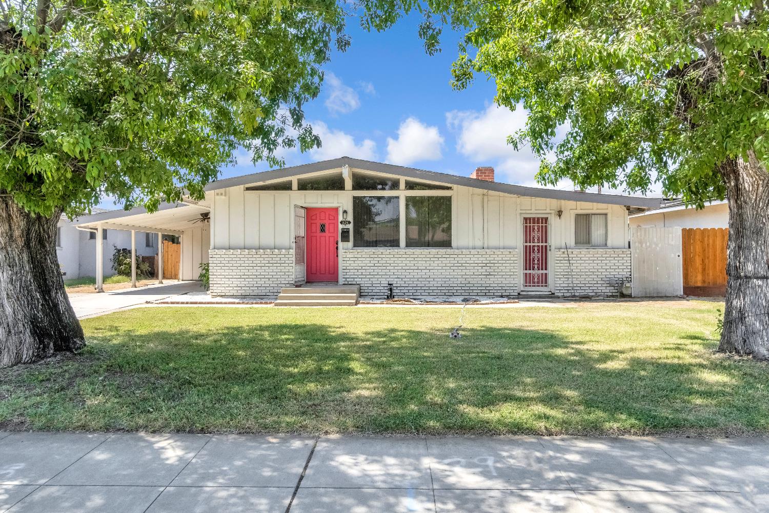 835 I Street Parlier, CA 93648 - Photo 1 of 27 a front view of house with yard and seating area