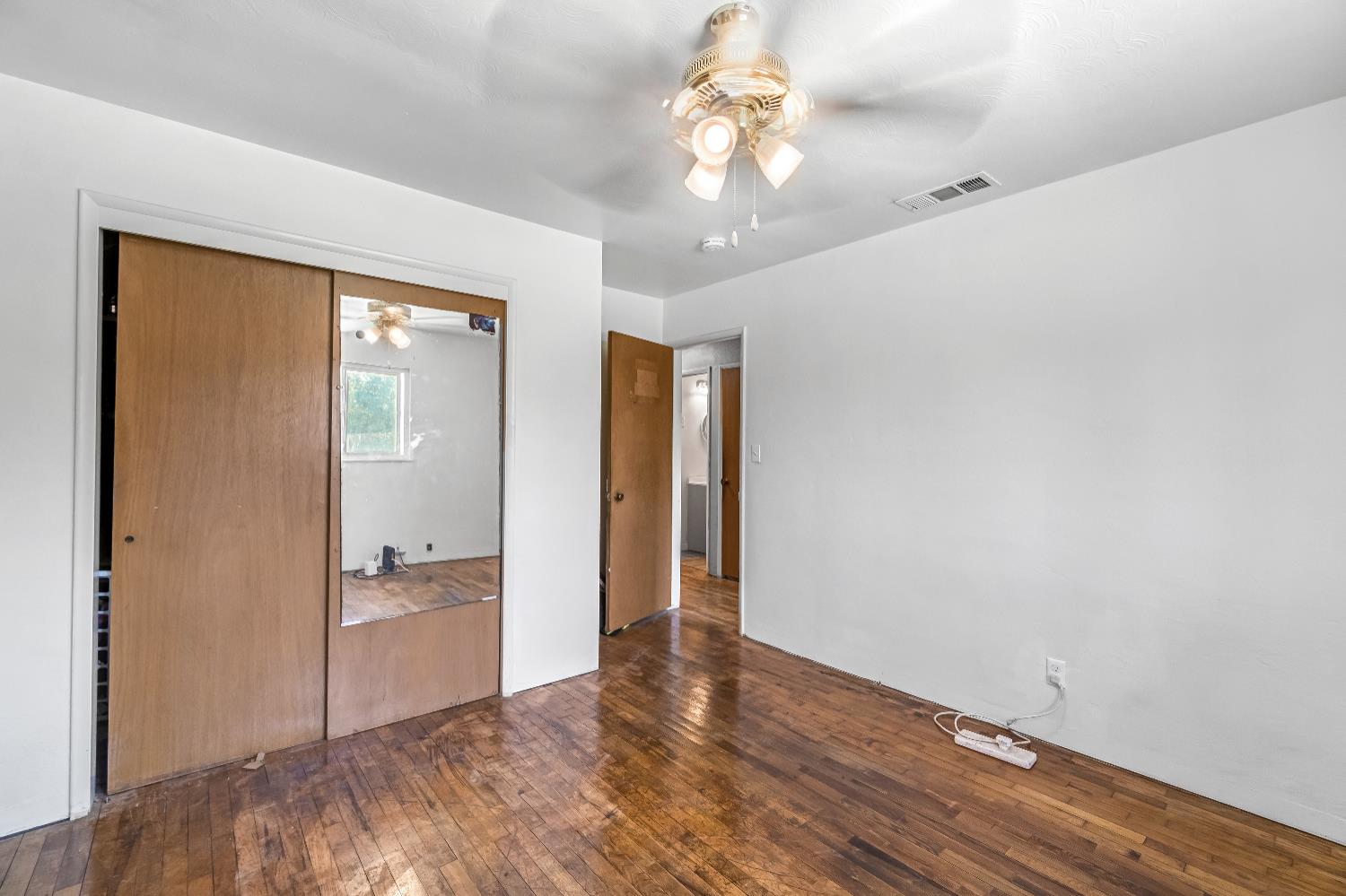 835 I Street Parlier, CA 93648 - Photo 24 of 27 wooden floor in an empty room