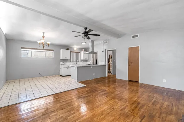 a view of kitchen with granite countertop cabinets and outdoor space