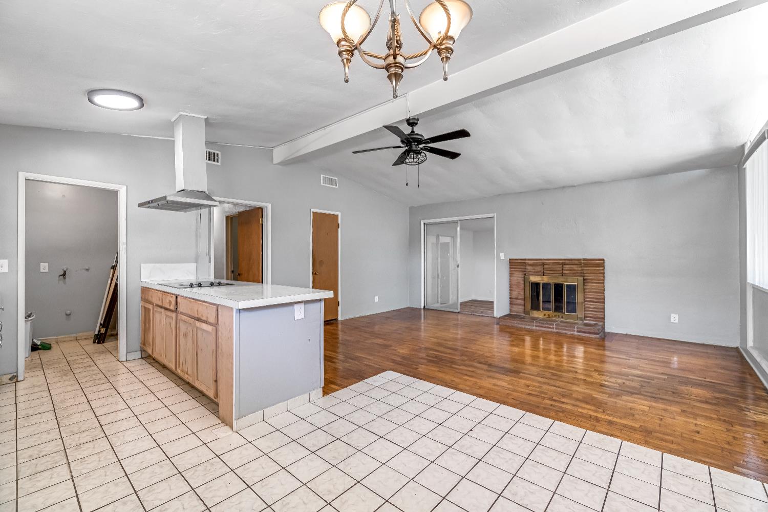 835 I Street Parlier, CA 93648 - Photo 10 of 27 a kitchen with stainless steel appliances a stove top oven and cabinets