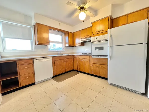 a kitchen with stainless steel appliances granite countertop a sink and cabinets