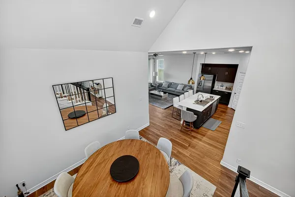 a view of an entryway with wooden floor