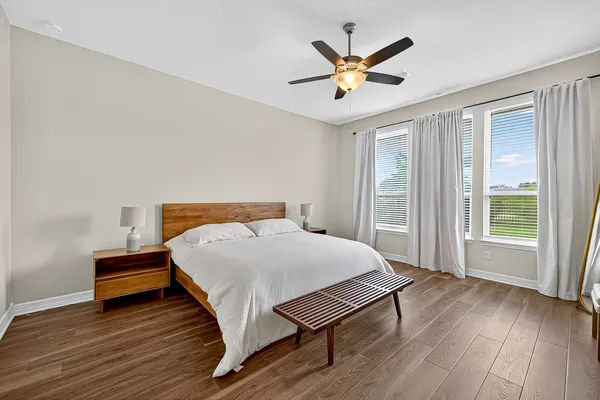 a bathroom with a glass shower door and a glass door
