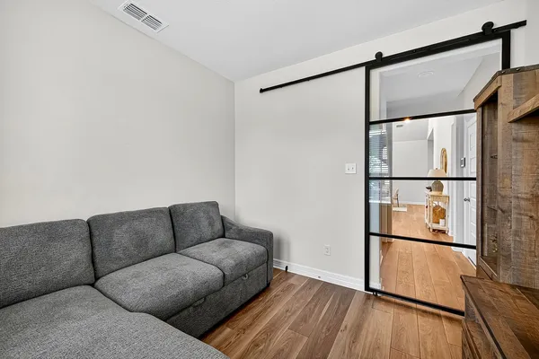 a living room with furniture and a window