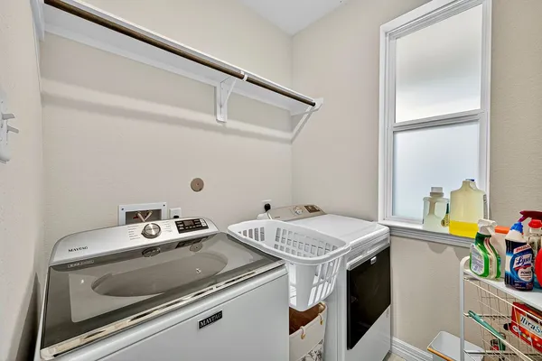 a bedroom with a bed and a night stand