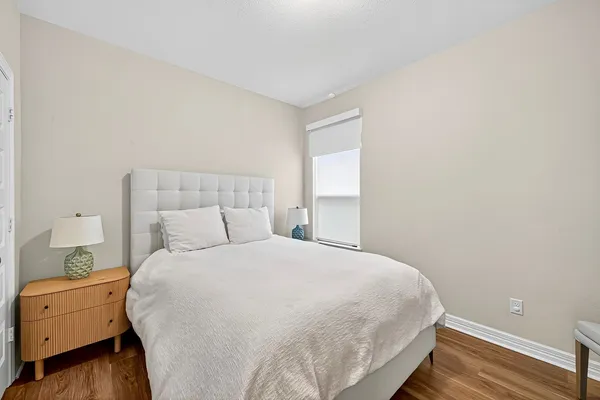 a white toilet and tub sitting next to a bathroom sink