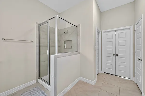 a view of a brick house with a large window