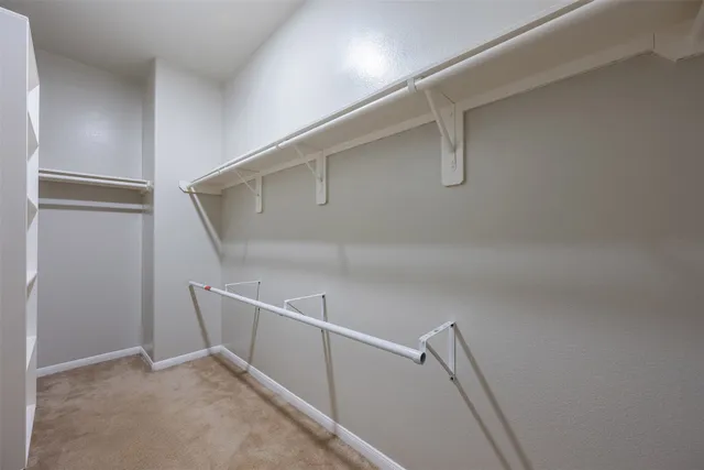 a view of an empty walk in closet
