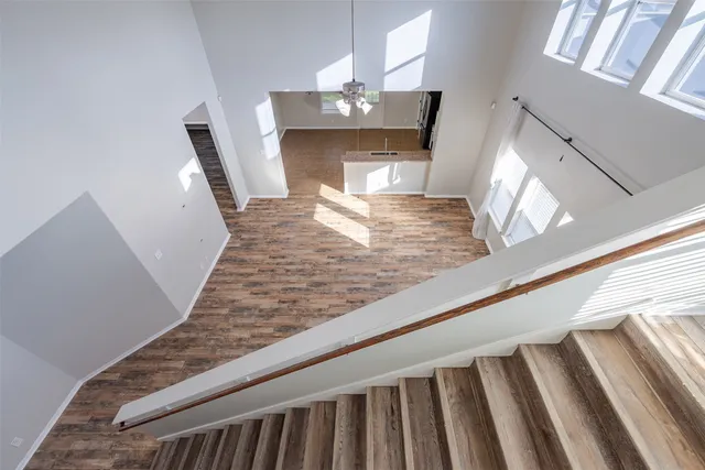 a view of a living room and wooden floor