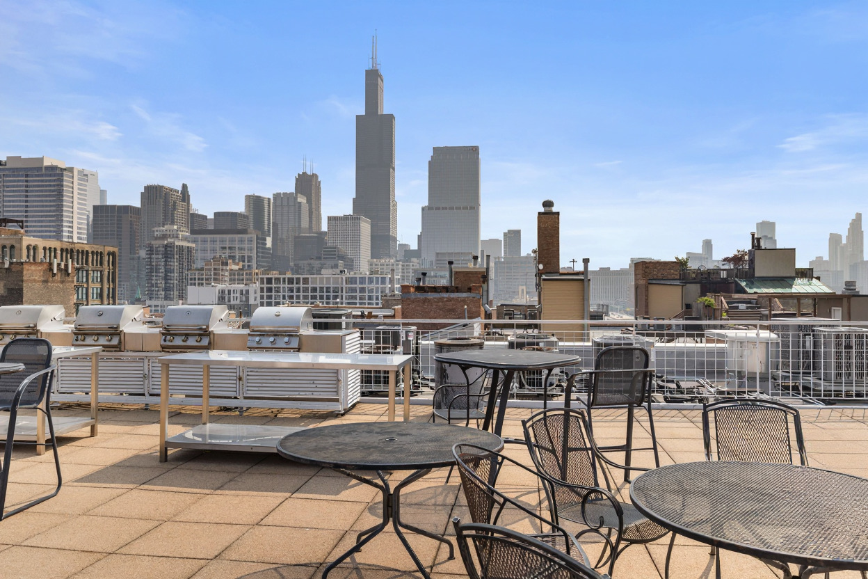 933 West Van Buren Street, Unit 910 Chicago, IL 60607 - Photo 4 of 6 a view of a terrace with furniture and stove