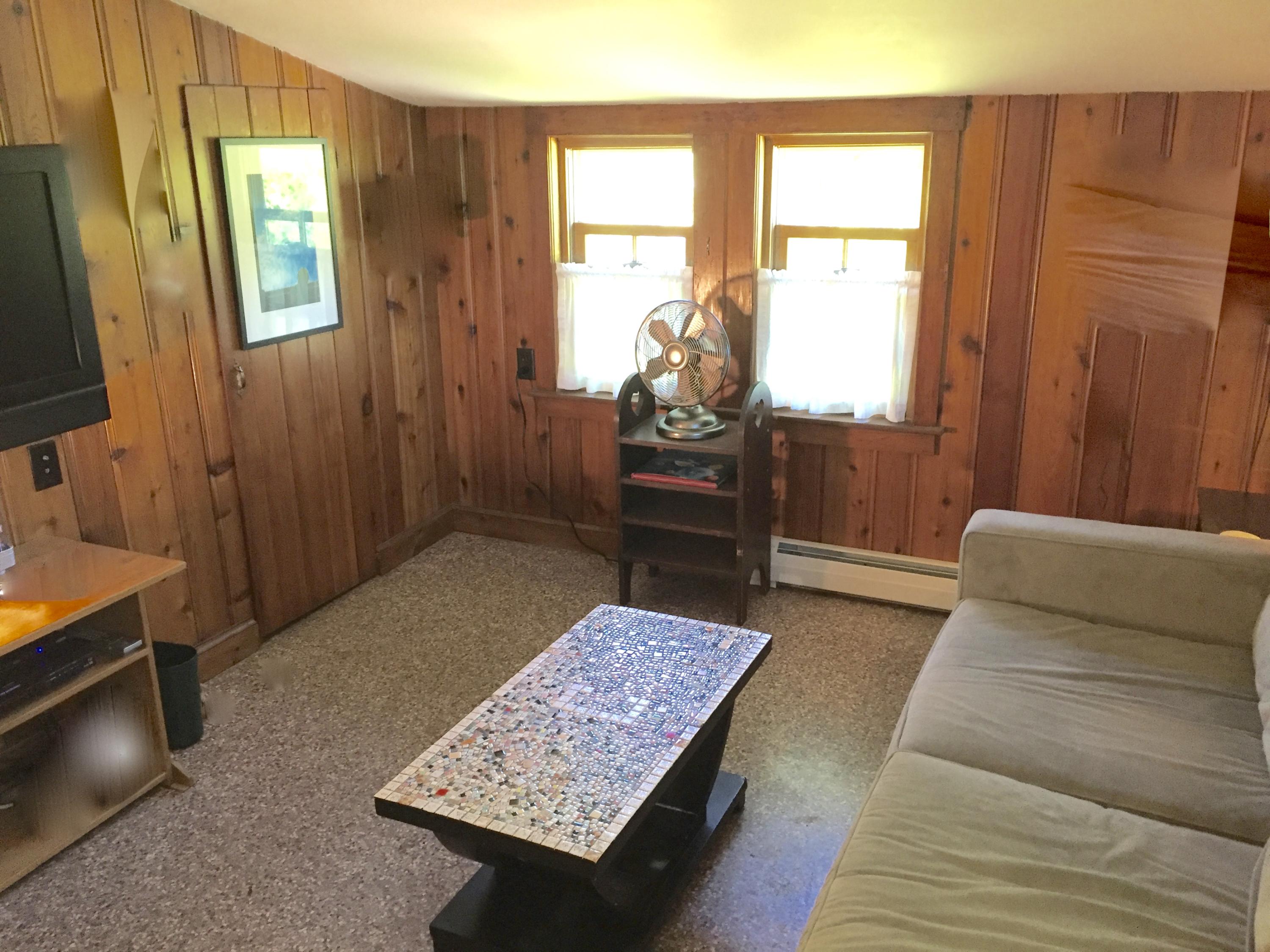 9 Francis Road Truro, MA 02666 - Photo 21 of 34 a living room with a couch and a dresser