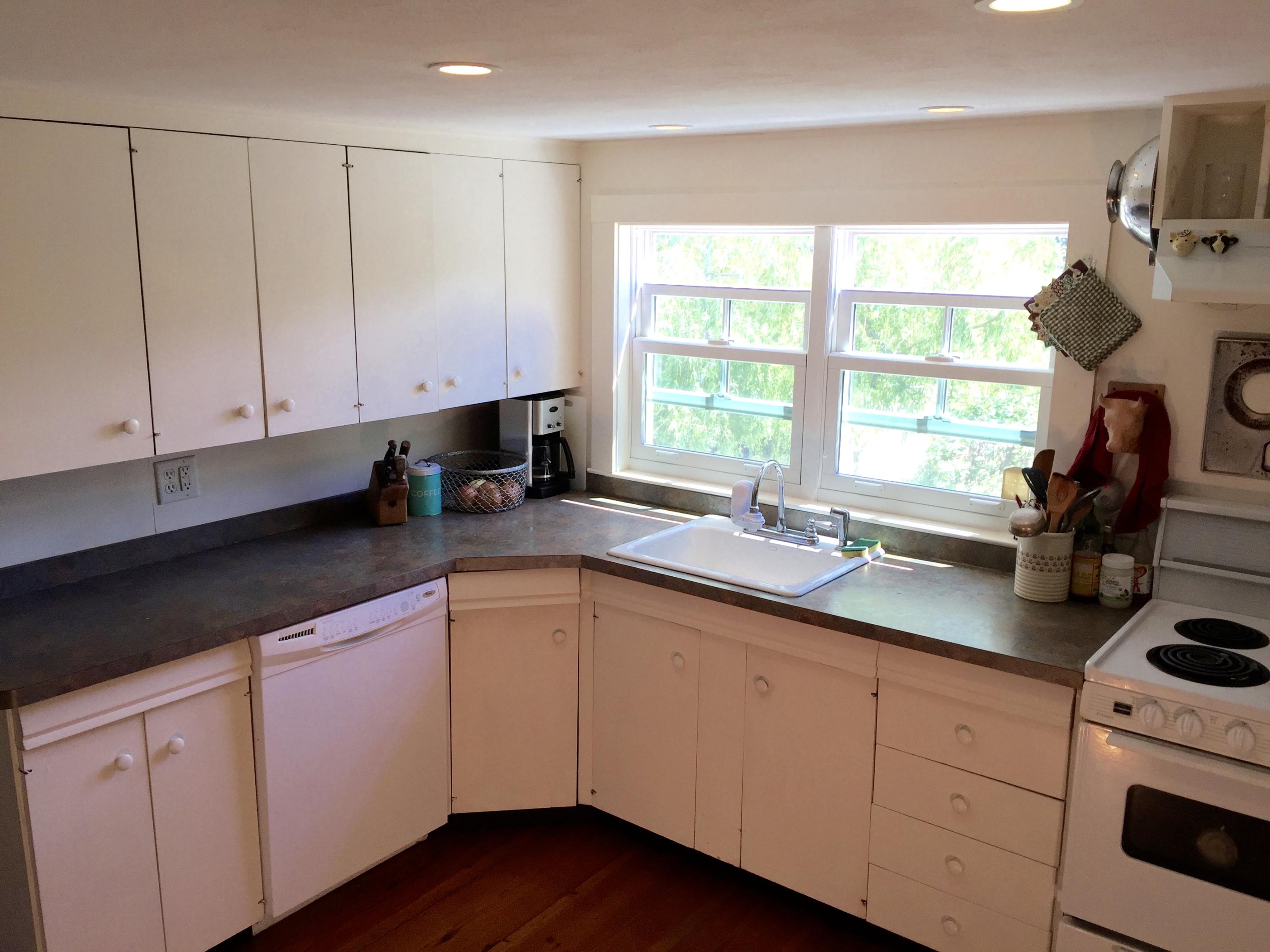 9 Francis Road Truro, MA 02666 - Photo 10 of 34 a kitchen with cabinets appliances a sink and a window