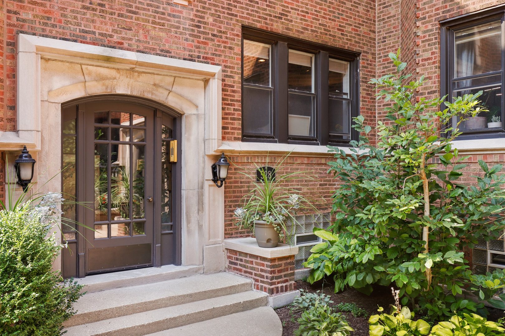 528 West Cornelia Avenue, Unit 2N Chicago, IL 60657 - Photo 1 of 19 a front view of a house with potted plants