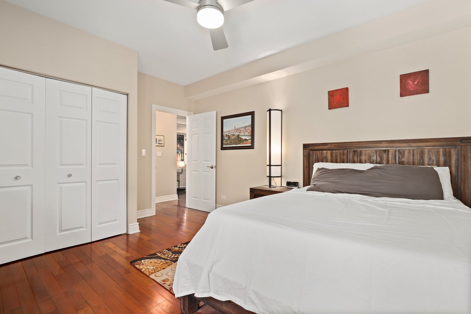528 West Cornelia Avenue, Unit 2N Chicago, IL 60657 - Photo 14 of 19 a bedroom with a bed and a painting on the wall