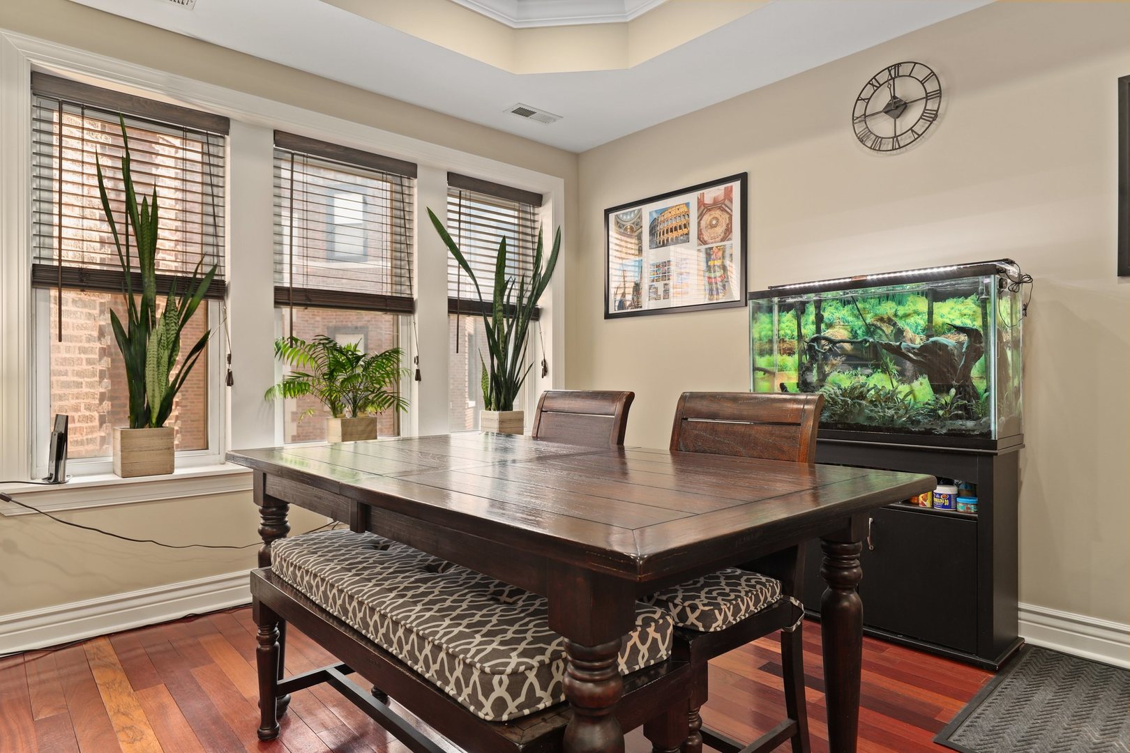 528 West Cornelia Avenue, Unit 2N Chicago, IL 60657 - Photo 4 of 19 a view of a dining room with furniture window and wooden floor