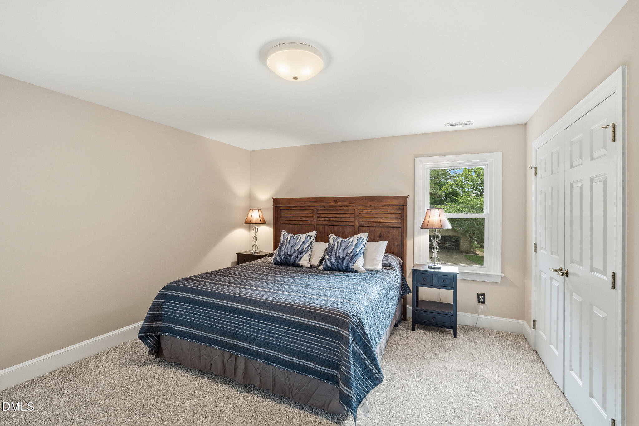 3735 Stoneybrook Drive Durham, NC 27705 - Photo 27 of 44 a bedroom with a bed and a lamp