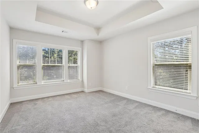 a bathroom with a sink toilet vanity and shower