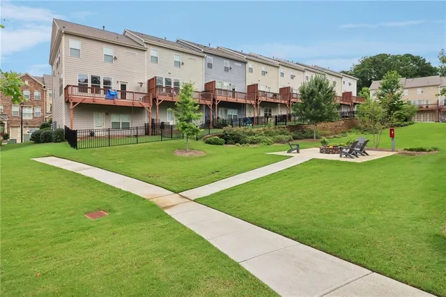 a view of a swimming pool with outdoor seating