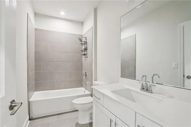 a bathroom with a sink toilet a bathtub and shower