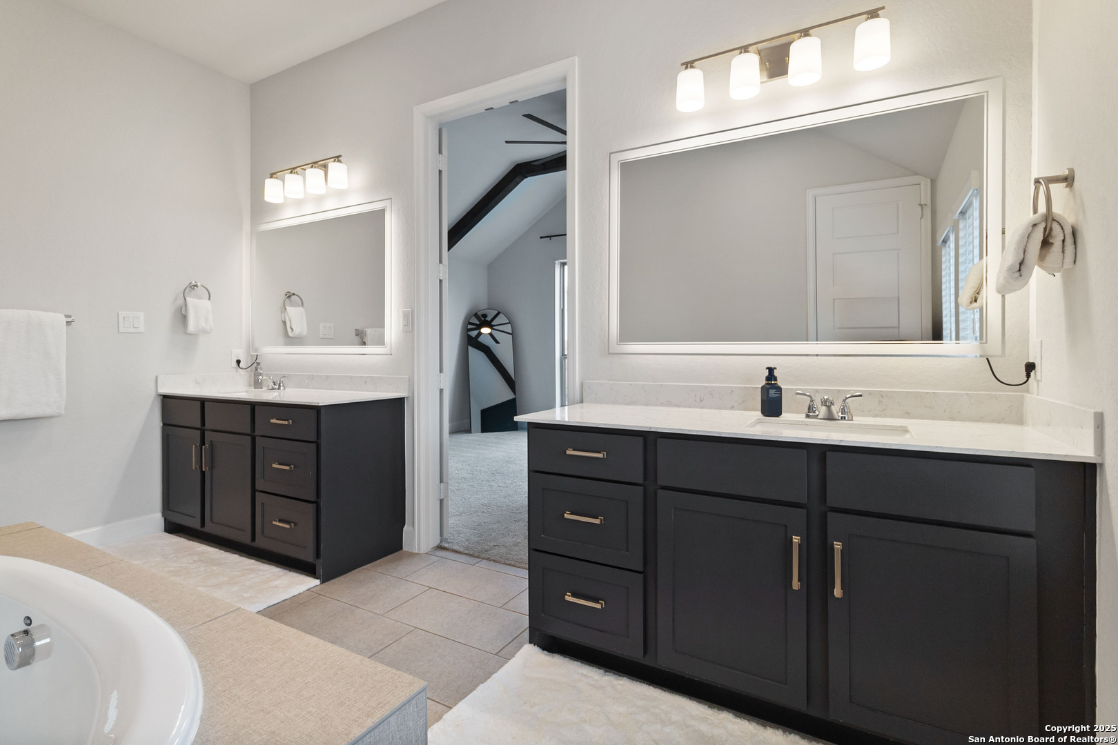 149 Red Oak Castroville, TX 78009 - Photo 11 of 16 a bathroom with a sink vanity and mirror