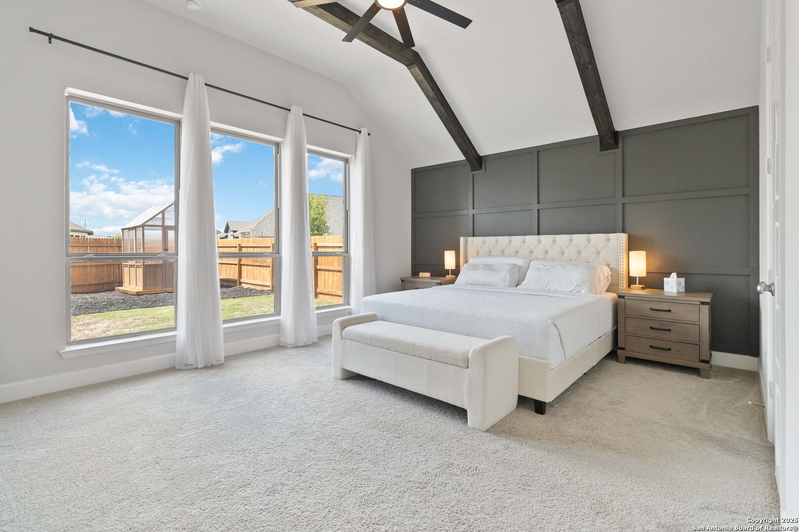 149 Red Oak Castroville, TX 78009 - Photo 10 of 16 a spacious bedroom with a bed and a large window