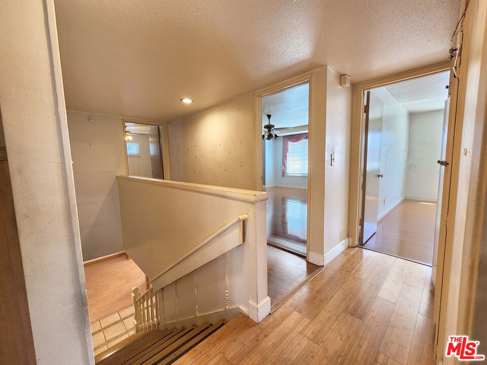 19002 Grandee Avenue Carson, CA 90746 - Photo 23 of 42 a view of hallway with stairs and wooden floor