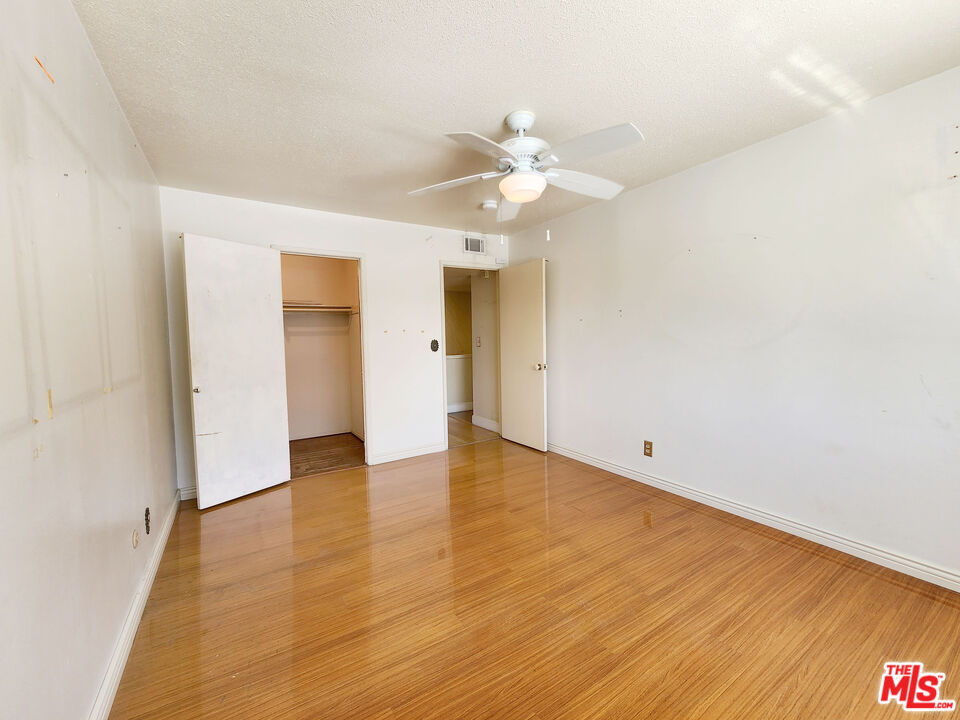 19002 Grandee Avenue Carson, CA 90746 - Photo 28 of 42 an empty room with wooden floor and ceiling fan
