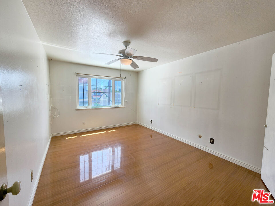 19002 Grandee Avenue Carson, CA 90746 - Photo 29 of 42 a view of an empty room with a window and wooden floor