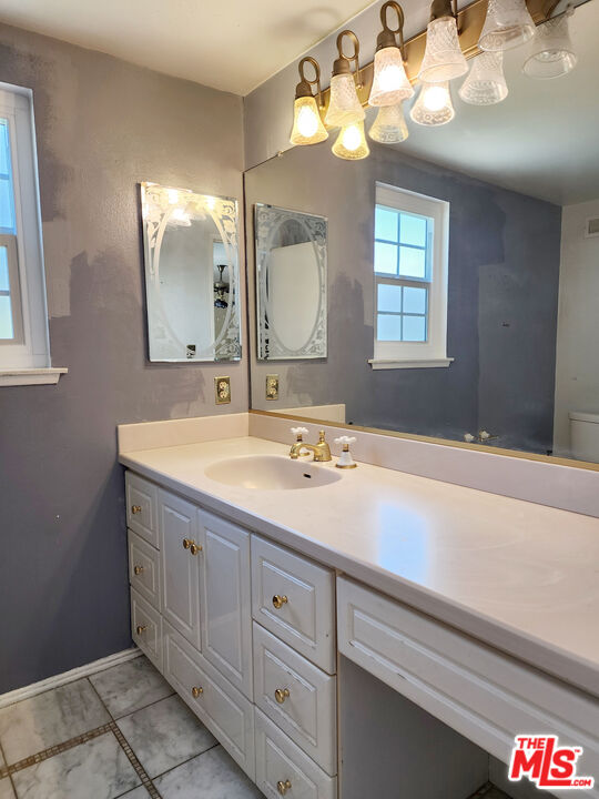 19002 Grandee Avenue Carson, CA 90746 - Photo 33 of 42 a bathroom with a sink a vanity and a mirror