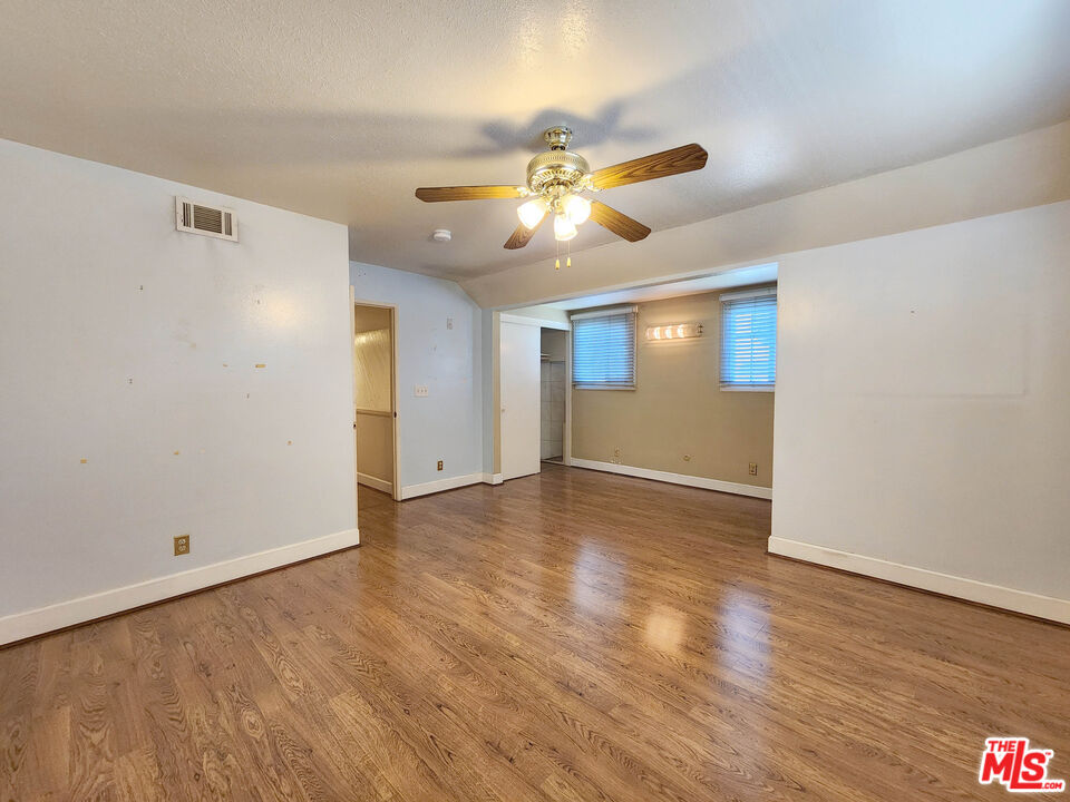19002 Grandee Avenue Carson, CA 90746 - Photo 35 of 42 a view of a livingroom with a ceiling fan & hardwood floor