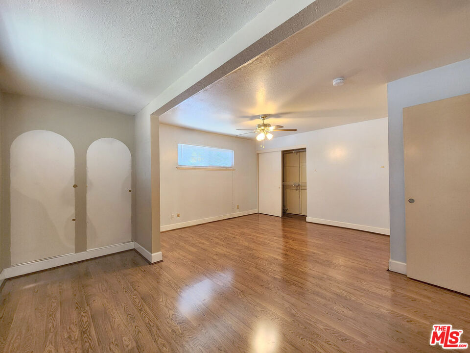 19002 Grandee Avenue Carson, CA 90746 - Photo 36 of 42 an empty room with wooden floor and windows