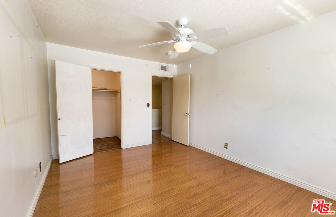 19002 Grandee Avenue Carson, CA 90746 - Photo 5 of 42 an empty room with wooden floor and ceiling fan