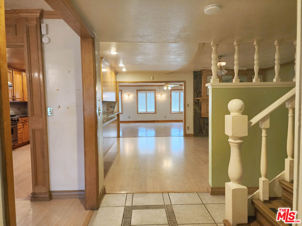 19002 Grandee Avenue Carson, CA 90746 - Photo 8 of 42 a view of a hallway with wooden floor and windows