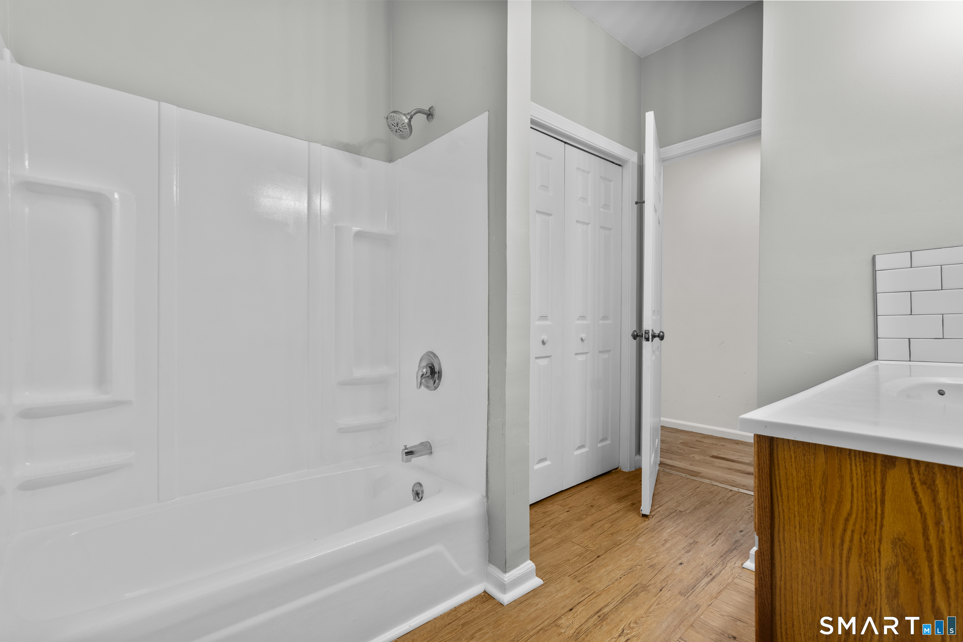 1847 Glasgo Road Griswold, CT 06351 - Photo 13 of 38 a bathroom with a bathtub and a shower