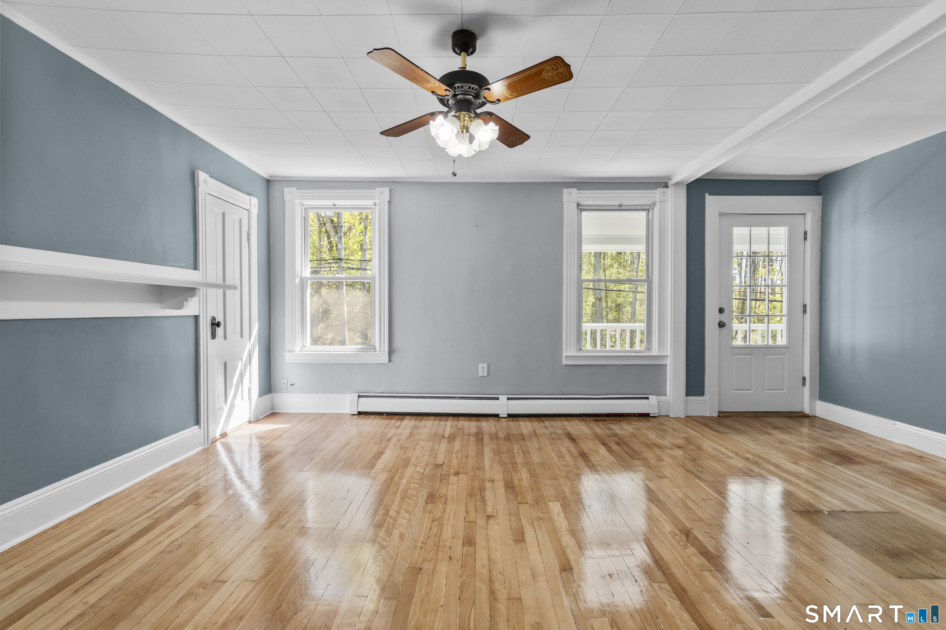 1847 Glasgo Road Griswold, CT 06351 - Photo 17 of 38 a view of empty room with wooden floor and fan
